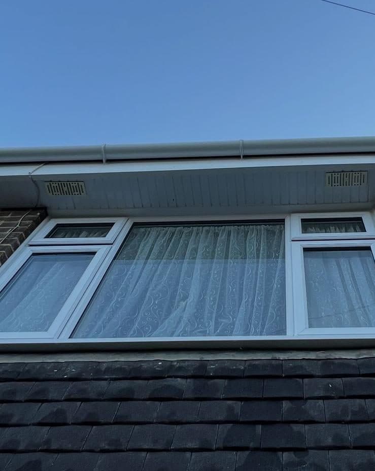 Bright white fascia and clear gutter after cleaning
