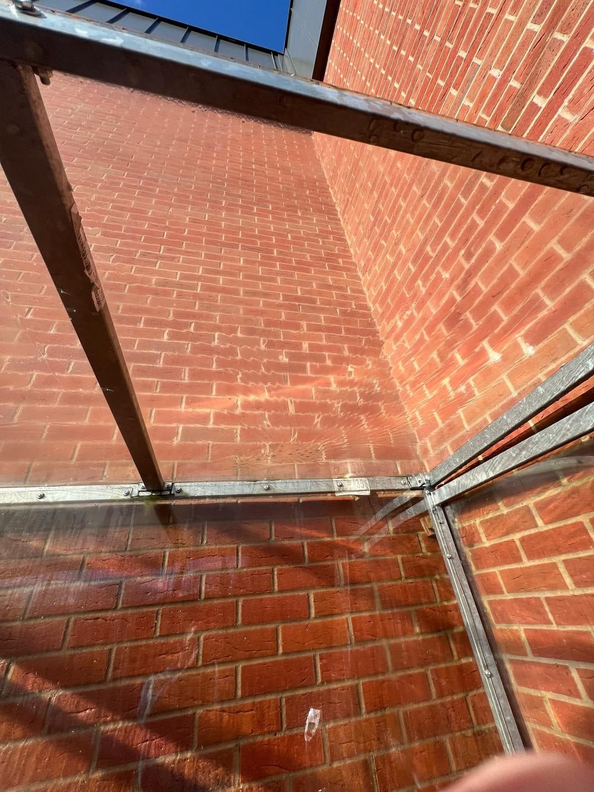 The same glass canopy crystal clear after cleaning